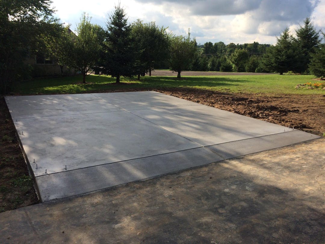 picture of a newly installed concrete outdoor parking spot